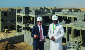 Michael Hernandez, left, consults with a colleague on-site in Saudi Arabia.