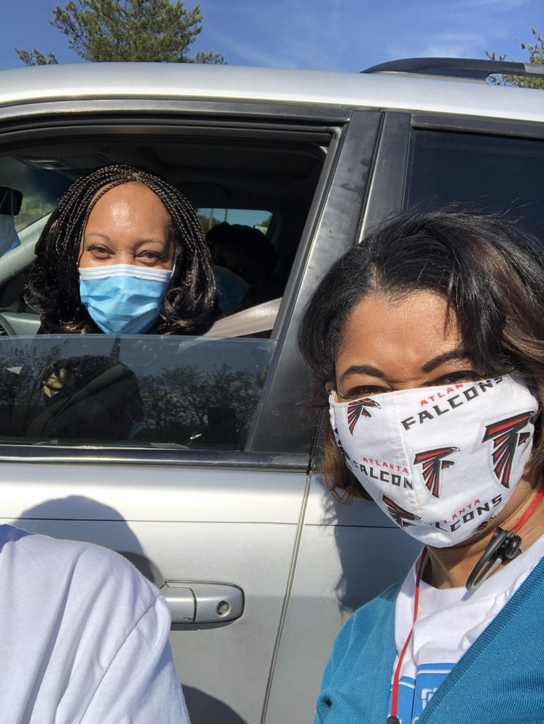 Drive-thru Food Bank mobile pantries generate smiles from volunteers and recipients.