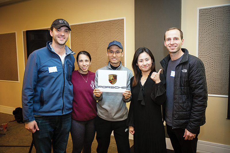 Third-place winning team includes, from left, Nick Ramsey, Elizabeth Hitti, Linxi Wu, Shuo Sun, Jim Sandeford. Not pictured: Michelle Pham. Photo taken last fall during Reveal Day, where students learned of consulting assignments.