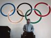 Matthew Jones sits in front of olympic rings