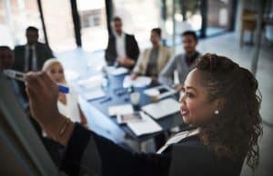 Black woman executive presents to colleagues