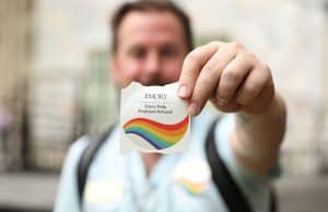 Andrew Moses, an Emory Pride Employee Network board member, helped pass out stickers for the group at Staff Fest. — Emory Photo Video