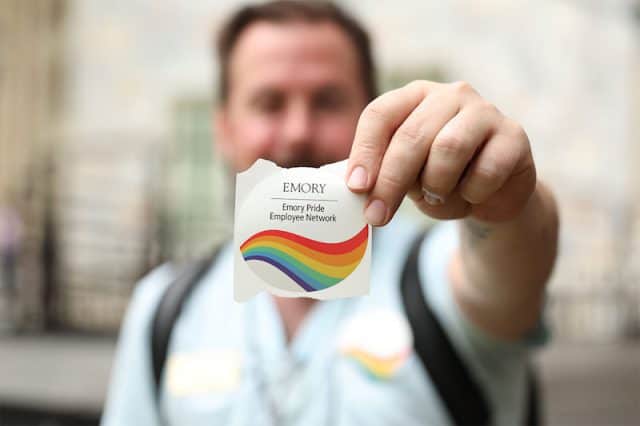 PRIDE_edited Andrew Moses, an Emory Pride Employee Network board member, helped pass out stickers for the group at Staff Fest. — Emory Photo Video