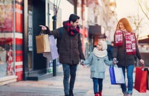 Family with one kid shopping together