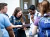 Students looking at laptop