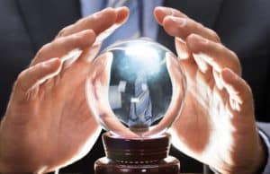 Hand holding crystal ball - Poets&Quants