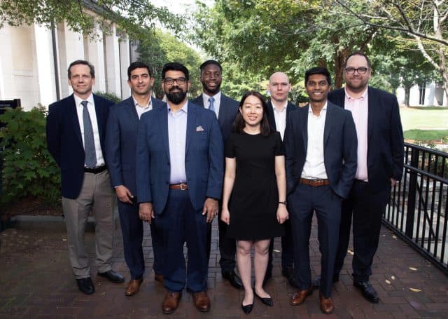 New faculty members standing outside of Goizueta