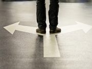 Feet and two arrows painted on floor.