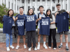 Goizueta BBA students from the class of 2024 pose with t-shirts at a social event.