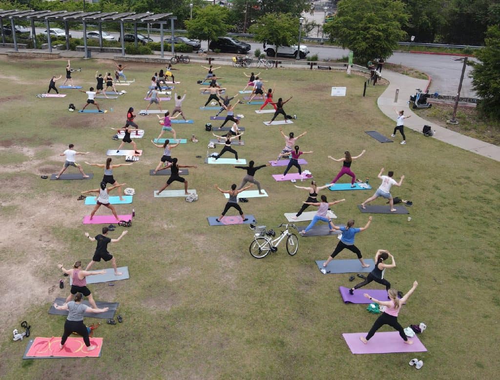 A Yoga instructor leading a class at Old 4th Ward Skatepark along the Atlanta BeltLine