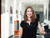 Laura Balser posing inside the Goizueta school building