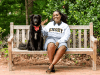 Osereme Ujadughele on a bench with her dog