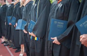 Goizueta grads holding diplomas