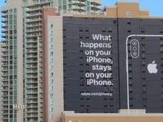 photo of outside of building with an Apple ad on it - from Bloomberg Law article