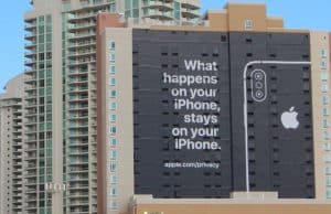 photo of outside of building with an Apple ad on it - from Bloomberg Law article