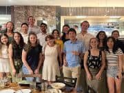 Members of Goizueta BBA Case Competition teams pose with faculty at a celebratory dinner.