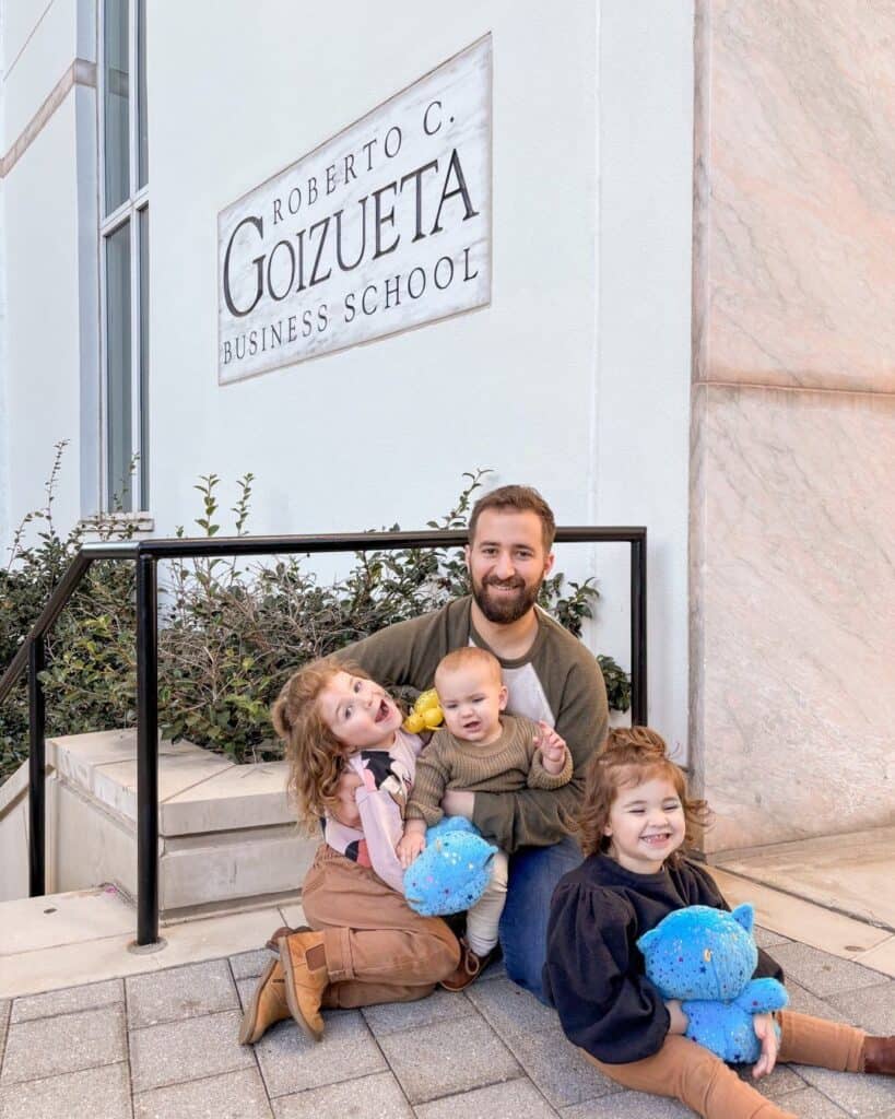 Jonathan Geller with his children enjoying a playful family moment outside Goizueta Business School