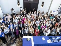 The roughly 300 attendees at Executive Women of Goizueta's 23rd Annual Leadership Conference, "Own your Own Path: Ignite, Elevate, Lead” gather for a group shot at Emory University.