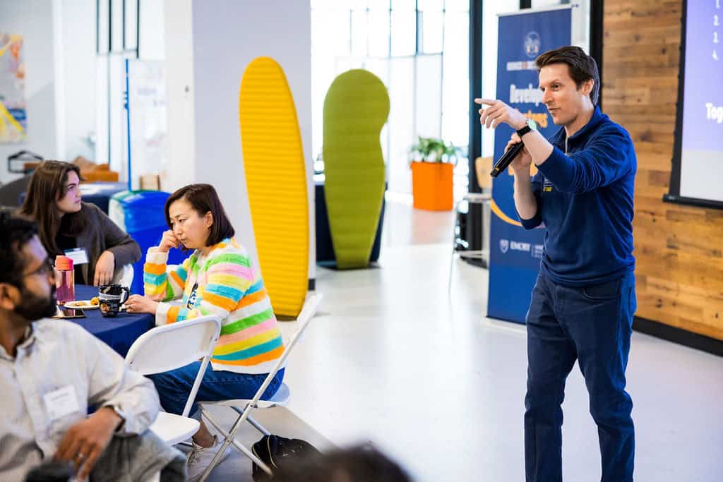 Brian Goebel addresses student participants during the Climate Design Challenge at The Hatchery.