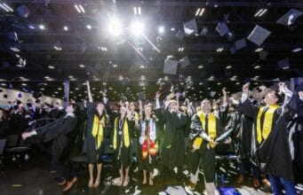 Goizueta Celebrates the Class of 2026 During Emory’s 181st Commencement Goizueta Business School graduates celebrate by tossing their caps in the air during the Class of 2026 commencement ceremony at Gas South Arena.