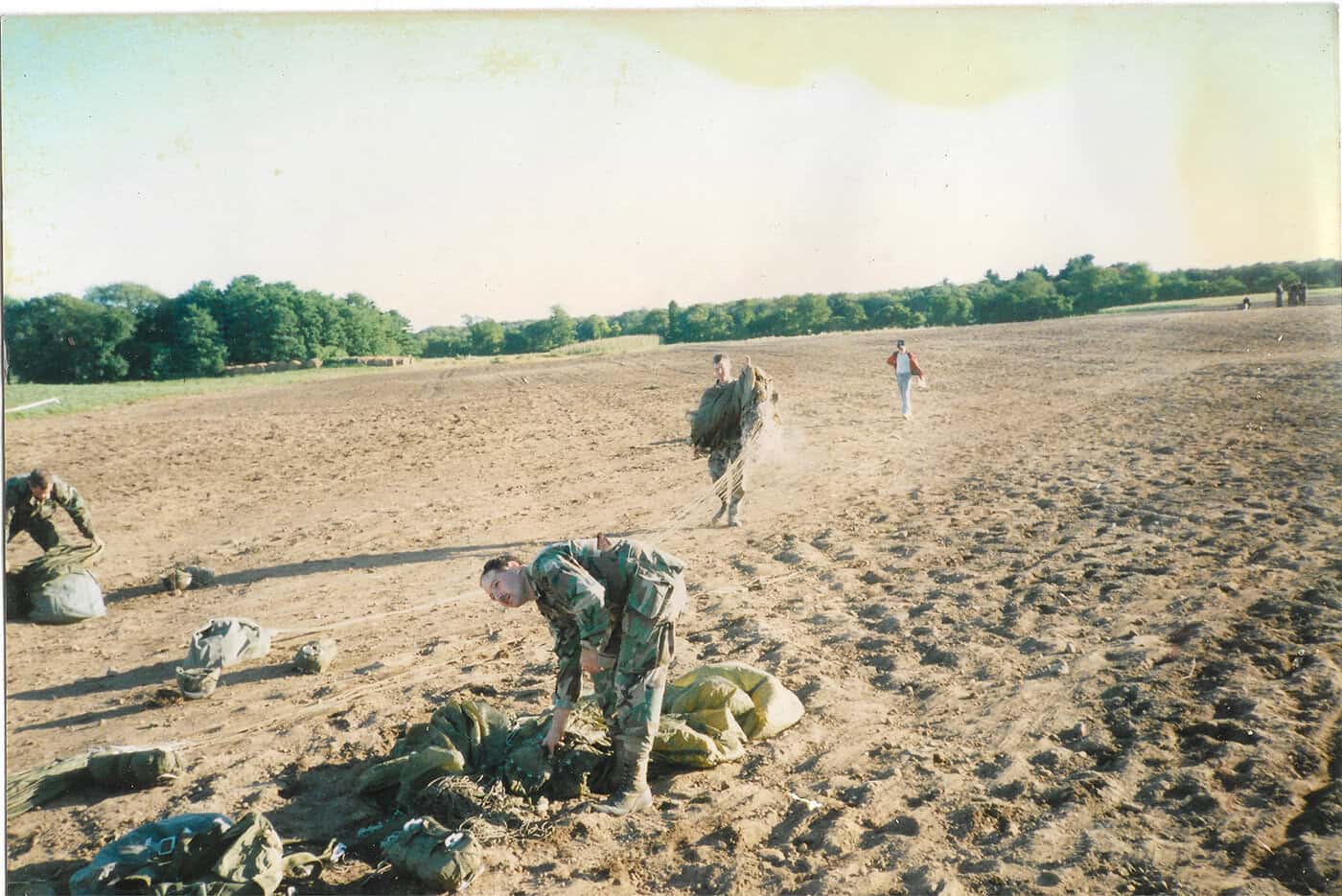 Long Range Surveillance Soldiers recover parachutes on Sicily Dropzone