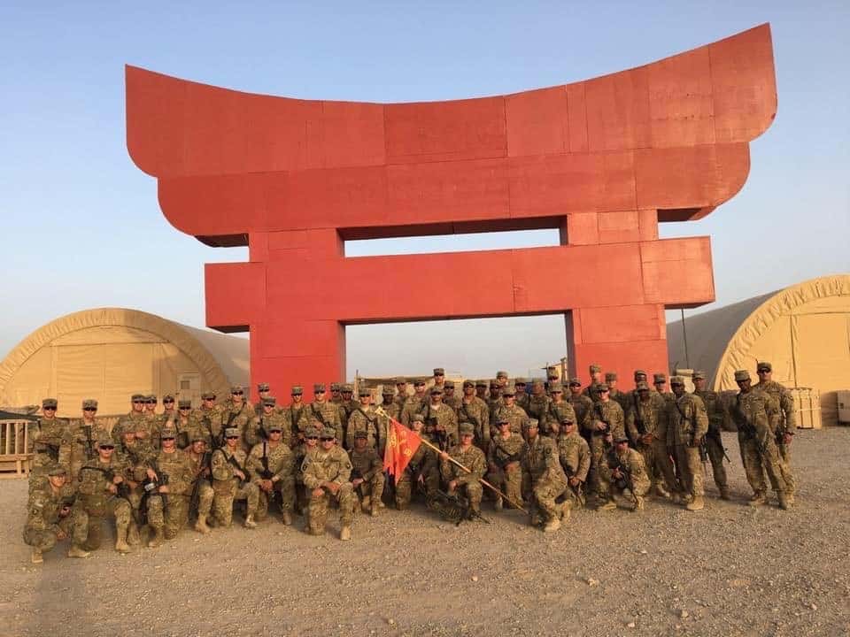 Unit: Bonecrusher Battery (B/3-320 FA) of 3rd Brigade, 101st Airborne Division aka the Rakkasans – I was the battery commander (Bonecrusher 6) and taking a knee to the left of the guidon. Location: Contingency Location (CL) Dwyer, Helmand Province, Afghanistan. Date: June 2017, the last family photo of the deployment