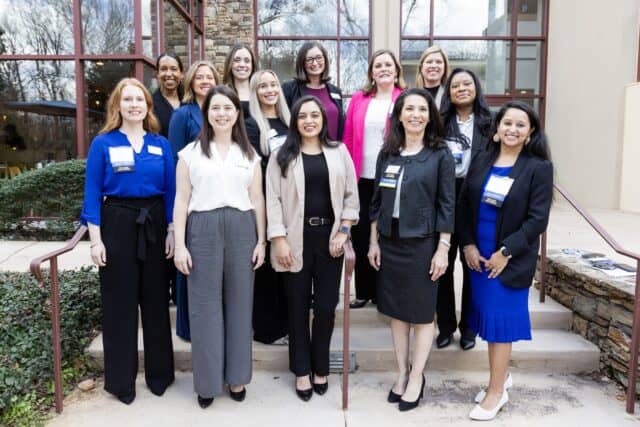 EWG 2026 Leadership Group Shot_7I6A3076 - resized Liz Wolfe 16MBA/MPH (bottom left) poses with members of the 2025-2026 Executive Women of Goizueta Board at the organization's annual conference March 6, 2026.